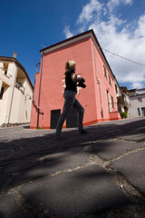 tourist walking under blue sky at Bessude in Logudoro Meilogu, Valley of the Volcanoes, Sassari Sardinia, Italy