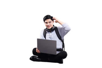 Tech Savvy Young Professional: A youthful individual is absorbed in thought while working on a laptop. With a relaxed posture, the person is lost in concentration with the modern technology.