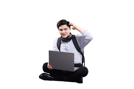 Tech Savvy Young Professional: A youthful individual is absorbed in thought while working on a laptop. With a relaxed posture, the person is lost in concentration with the modern technology.