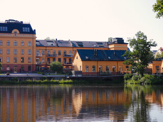 Buildings next a river during summer