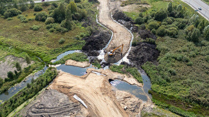 Aerial View of Construction Site with Excavator