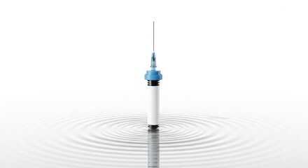 Ripple effect concept with a medical syringe in water.