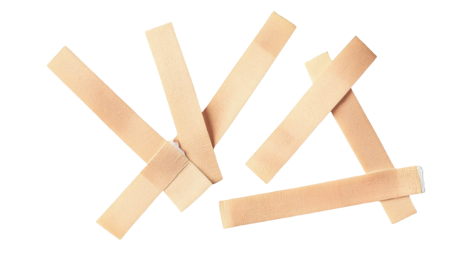 Adhesive bandage strips in various shapes and sizes on white background