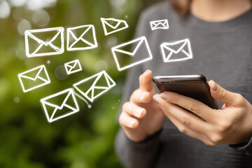 Person using smartphone with illustrated email icons floating around
