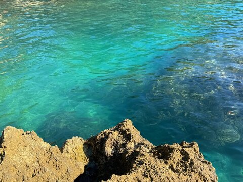 Sea clear waters and coastal rock.