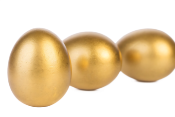 Golden eggs on white background isolated on a transparent background