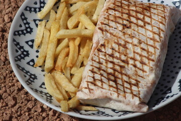 French tacos and french fries close up
