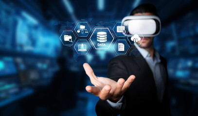 A man wearing virtual reality glasses interacts with digital data and cloud computing graphics, showcasing modern storage solutions in a futuristic tech environment. XDMCP