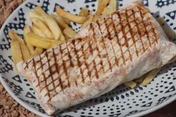 French tacos and french fries close up