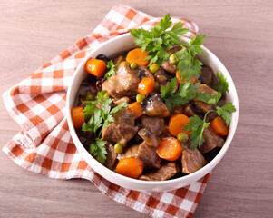 stew with mushrooms, carrot and peas