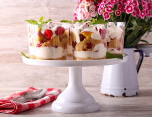 Peach and raspberry trifle dessert in glasses