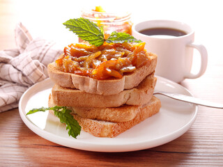 Homemade orange marmalade on toasts