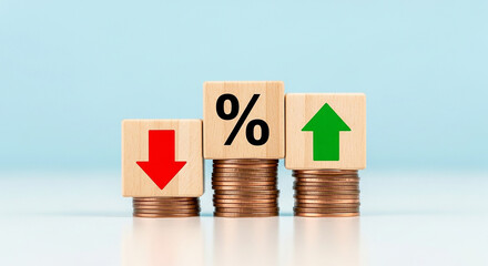 Financial growth and decline concept with percentage sign red down arrow and green up arrow on wooden blocks stacked on coins representing economic trends

