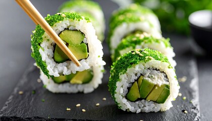 Avocado Sushi Rolls with Green Tobiko, Isolated on Black Background