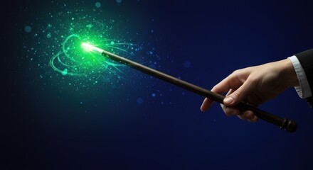 Fototapeta premium A hand holding a glowing green magic wand, emitting sparks and energy, against a dark background.
