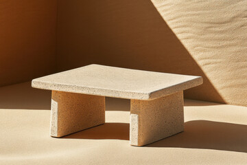 Minimalist stone table on sand surface with geometric shapes and contrasting shadows. Modern contemporary design for interior or decor concept.