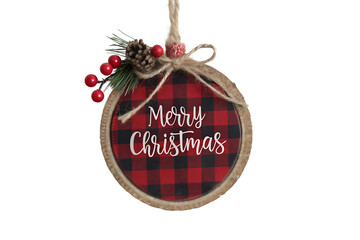 PNG image of Rustic wooden Christmas ornament with buffalo plaid and "Merry Christmas" text, hanging on a white wall.