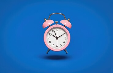 Pink alarm clock with gold accents on deep blue background. Clock hour hand rests on minute hand slightly tilted right. Soft light bathes scene. Vibrant color stands out against dark backdrop. Alarm