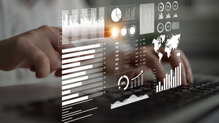 A professional user engages with interactive dashboards and analytics on a laptop, highlighting essential data visualizations in a modern business workspace. Impute