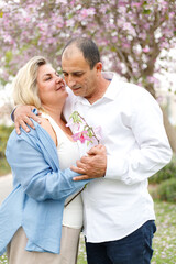 Marry me. Charming plump woman looks at her man. Middle age