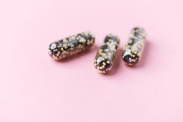 Iron capsules on bright background. Soft focus. Close up. Copy space.	