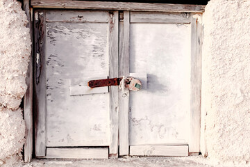 rusty lock on white painted window