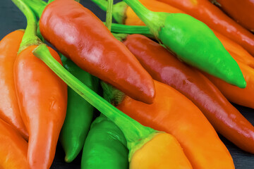 chili pepper red, yellow asia seasoning on black background