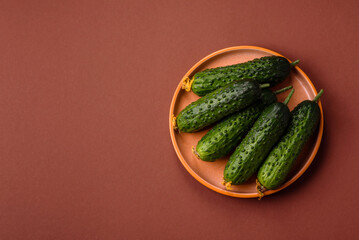 Fresh raw whole cucumbers, an ingredient for preparing salads and vegetarian dishes. Green fresh cucumbers