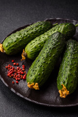 Fresh raw whole cucumbers, an ingredient for preparing salads and vegetarian dishes. Green fresh cucumbers