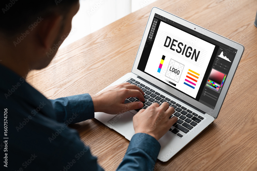Wall mural graphic designer software for modern design of web page and commercial ads showing on the computer s