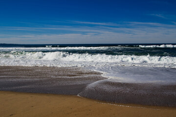 Ocean Waves Breaking With Sand Beach Blue Sky White Clouds