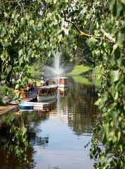 Traditional wooden boat on canal in Riga