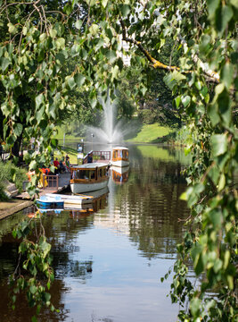 Traditional wooden boat on canal in Riga