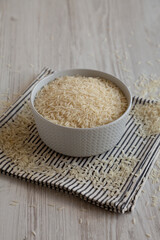 Uncooked White Organic Basmati Rice in a Bowl, side view.