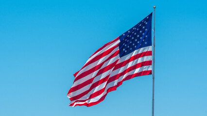 The Red White and Blue American Flag flying high