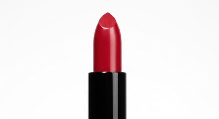 Smooth, red lipstick with a black tube stands against a white background