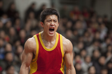 dedicated crossword athlete captured midaction during intense match showcasing emotions of either joy or