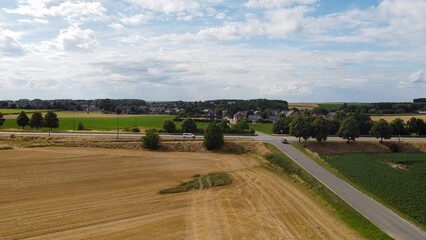 Drone flight over field of freshly harvested grain