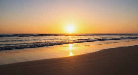 Fototapeta premium Golden Sunrise Over Ocean Waves on a Sandy Beach
