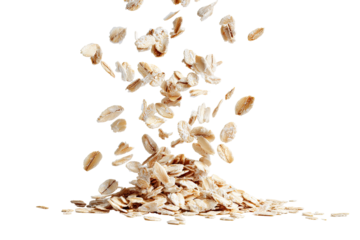 Oatmeal flakes in mid-air, cascading from a pile