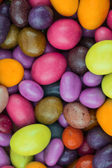 confectionery background sweets with multicolored sugar icing dragee green red lilac festive base wrapper