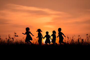 Fototapeta premium Silhouette, group of happy children playing on meadow,