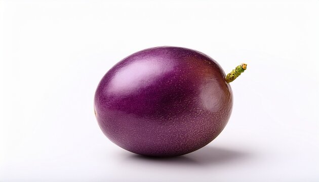 a single ripe passion fruit with a wrinkled purple skin isolated on a white background