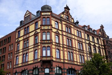 Fototapeta premium Historic Gründerzeit building in the old town of Hannover, Germany, with ornate facade, arched windows, and vibrant architectural details.