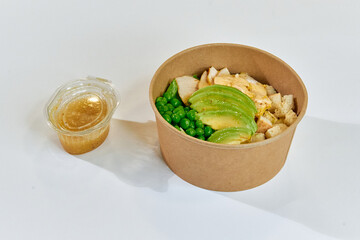 Delicious Healthy Meal in a Bowl Featuring Chicken, Avocado, Peas, and Flavorful Dressing – Perfect for Nutrition and Flavor Lovers