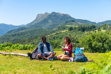 Hikers resting and enjoying scenic mountain view