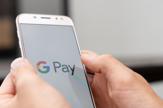 Close‑up of smartphone with Google Pay app open, contactless payment and mobile wallet