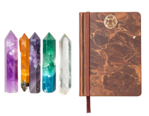 Vibrant crystal points and elegant leather journal evoke spiritual wellness and creative inspiration