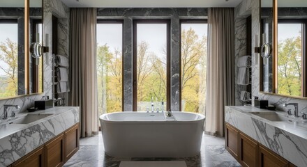 Luxurious bathroom featuring a freestanding tub and forest views