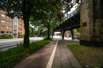 Scenic Walkway Under Vintage Overpass in Hamburg, Germany